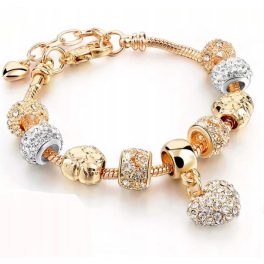   Arany színű charm karkötő cirkóniás charmokkal és szív medállal